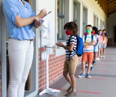 Jack Arrives at school and lines up for Sanitiser Spritz